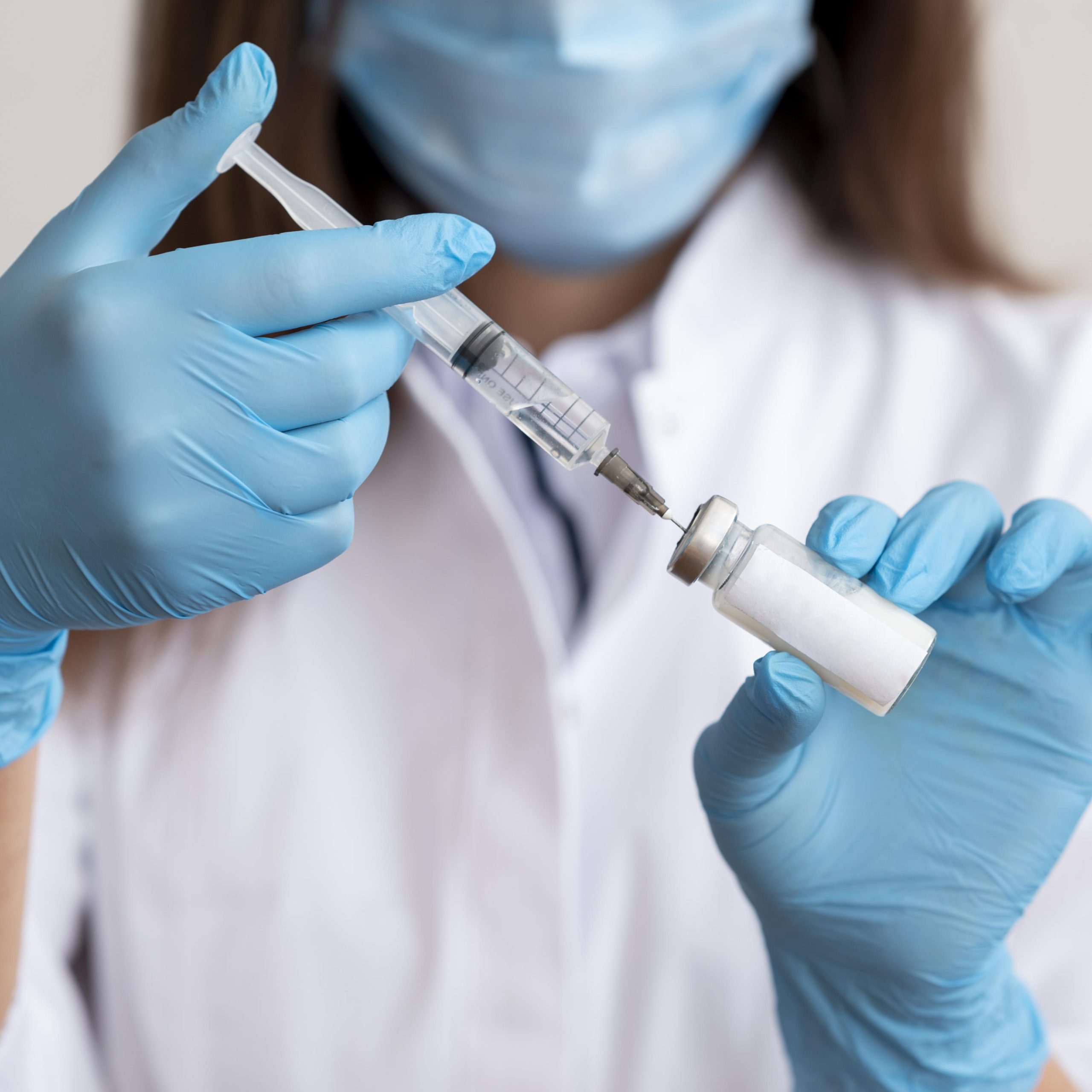 Doctor preparing medical vaccine scaled